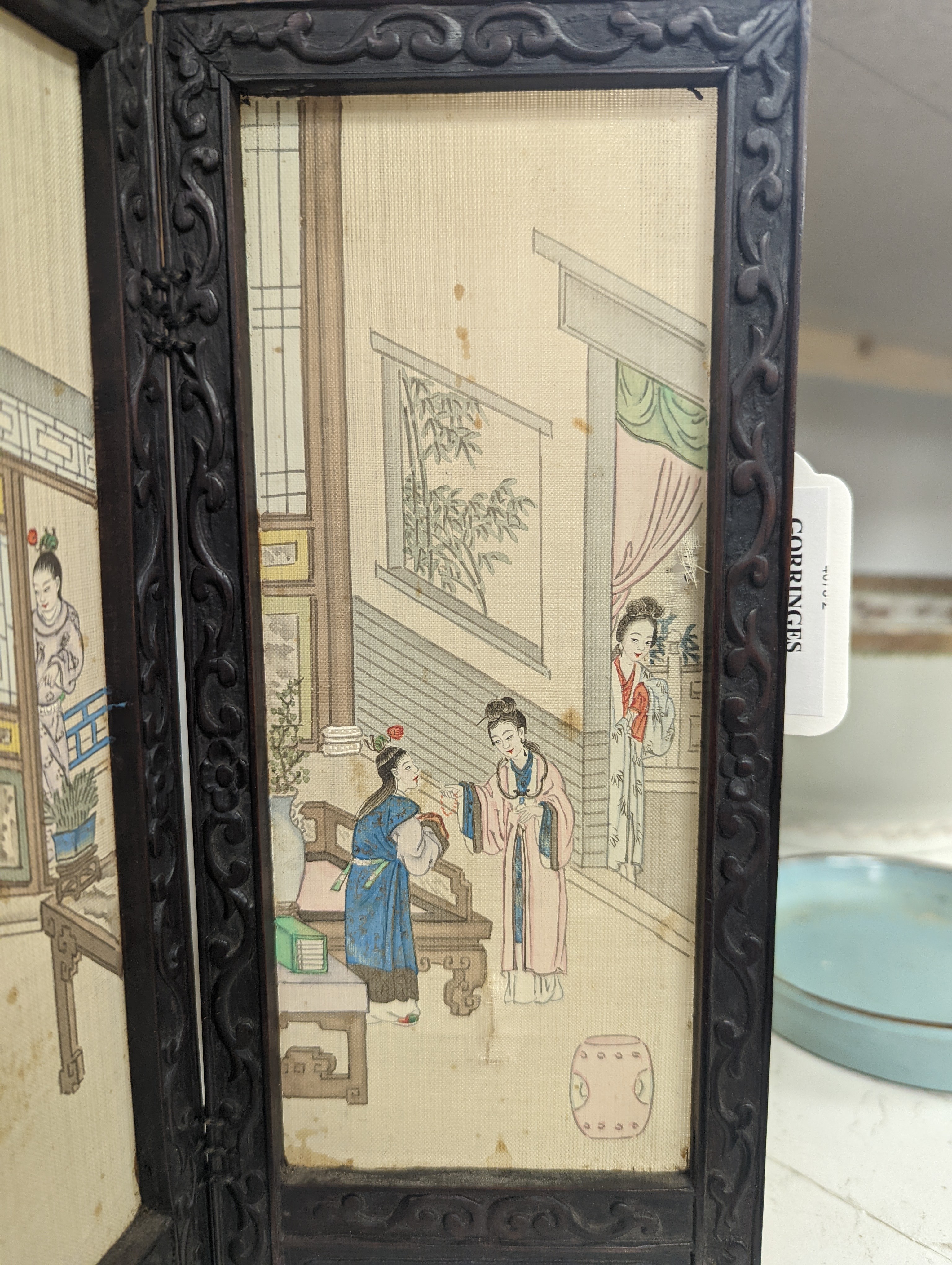 A Chinese hardwood framed painted silk four fold miniature screen, inset with painted silk panels, 28cm